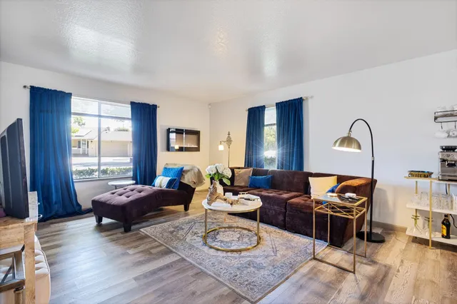 a living room with furniture and a window