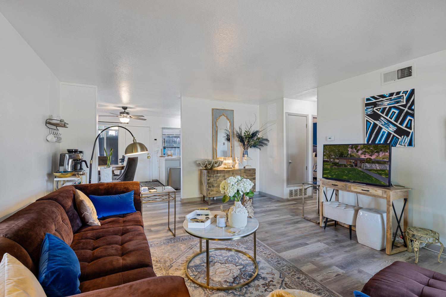 6415 Plymouth Road Stockton, CA 95207 - Photo 7 of 29 a living room with furniture and a flat screen tv