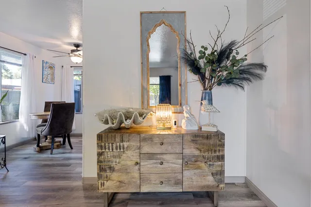 a living room with furniture and a potted plant