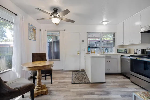 a room with cabinets and wooden floor