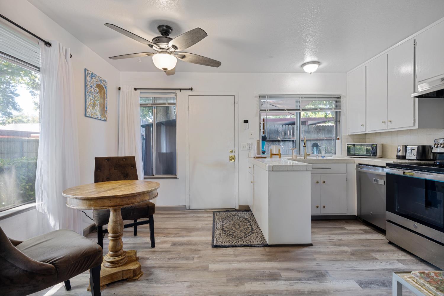 6415 Plymouth Road Stockton, CA 95207 - Photo 10 of 29 a room with cabinets and wooden floor
