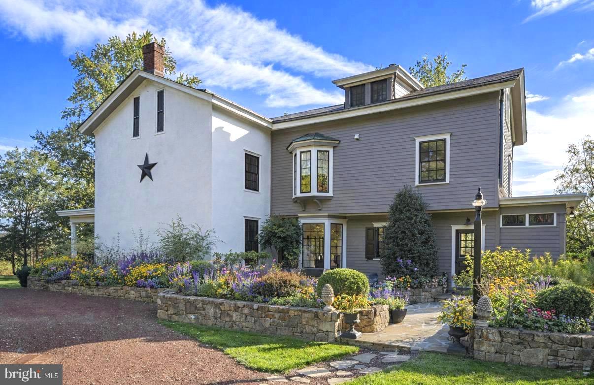 3307 Windy Bush Road New Hope, PA 18938 - Photo 5 of 58 a front view of a house with garden