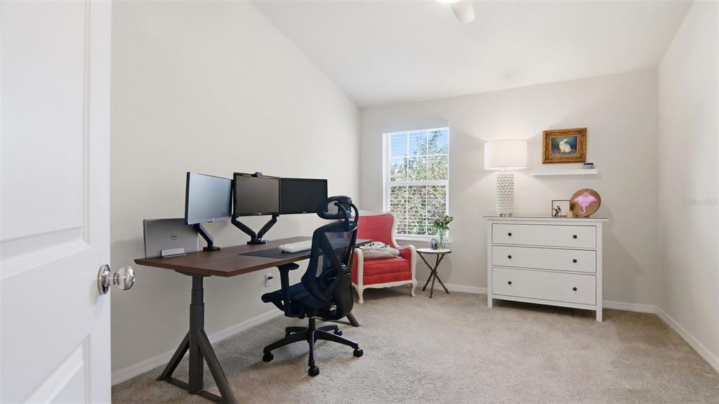 3013 Alessa Loop Apopka, FL 32703 - Photo 22 of 31 a view of a workspace with furniture and a window