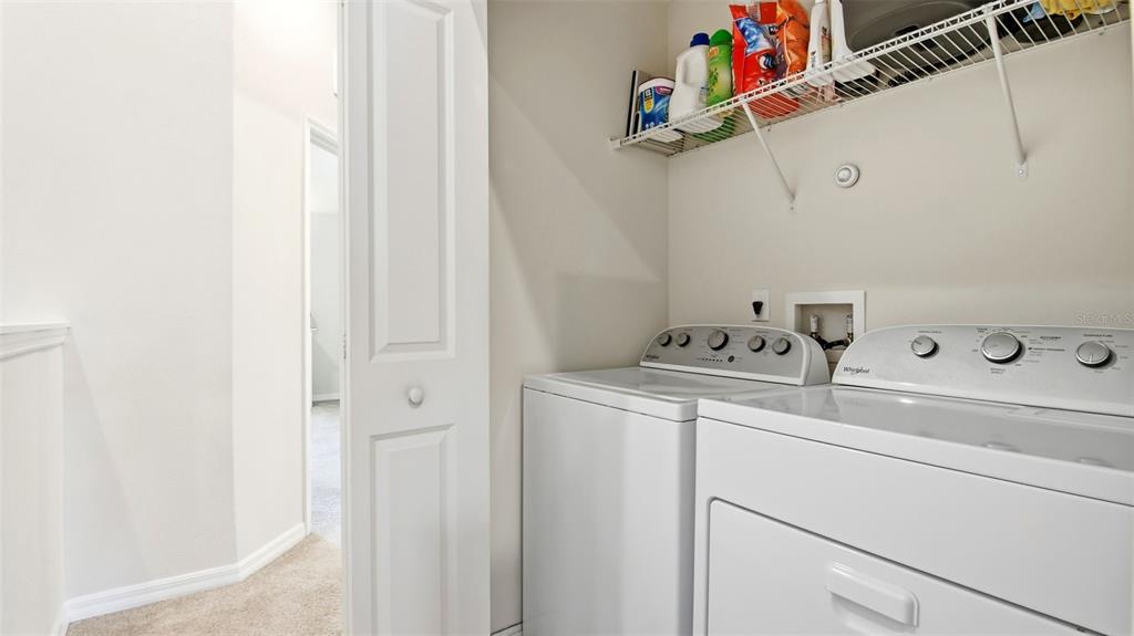 3013 Alessa Loop Apopka, FL 32703 - Photo 25 of 31 a utility room with dryer and washer
