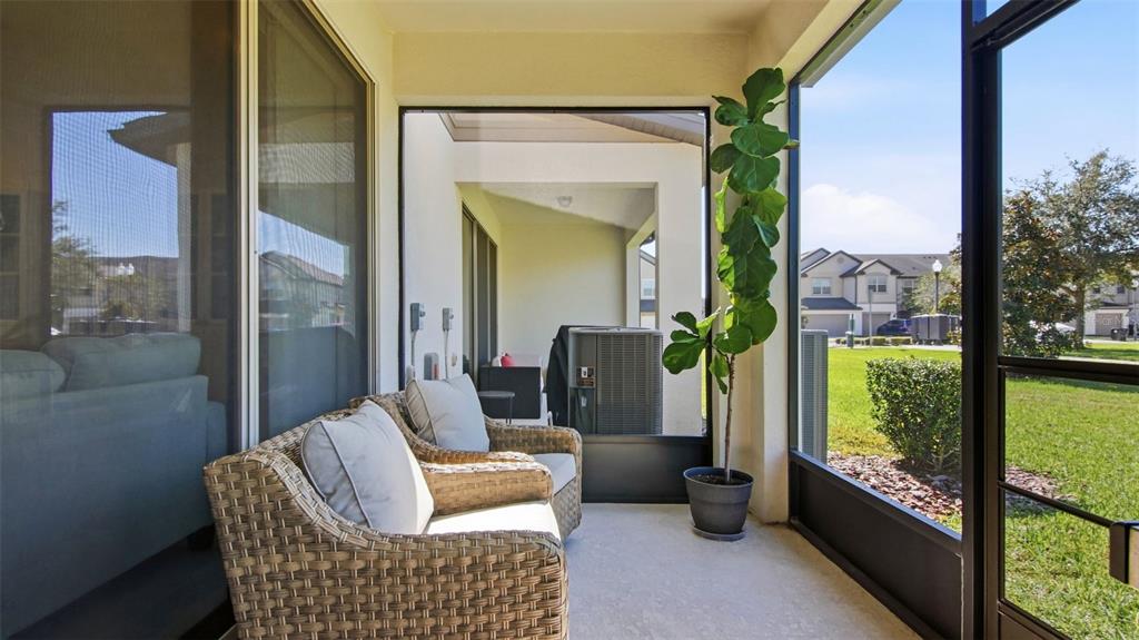 3013 Alessa Loop Apopka, FL 32703 - Photo 27 of 31 a balcony with furniture and a potted plant
