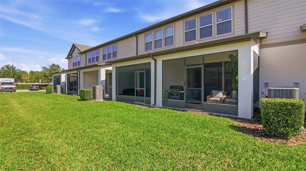 3013 Alessa Loop Apopka, FL 32703 - Photo 28 of 31 a view of a house with a yard and plants