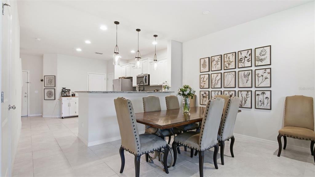3013 Alessa Loop Apopka, FL 32703 - Photo 9 of 31 a dining room with furniture and window