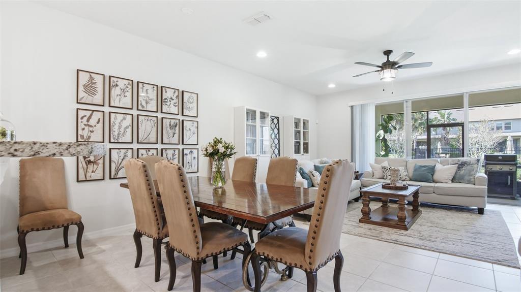3013 Alessa Loop Apopka, FL 32703 - Photo 10 of 31 a living room with furniture and a chandelier
