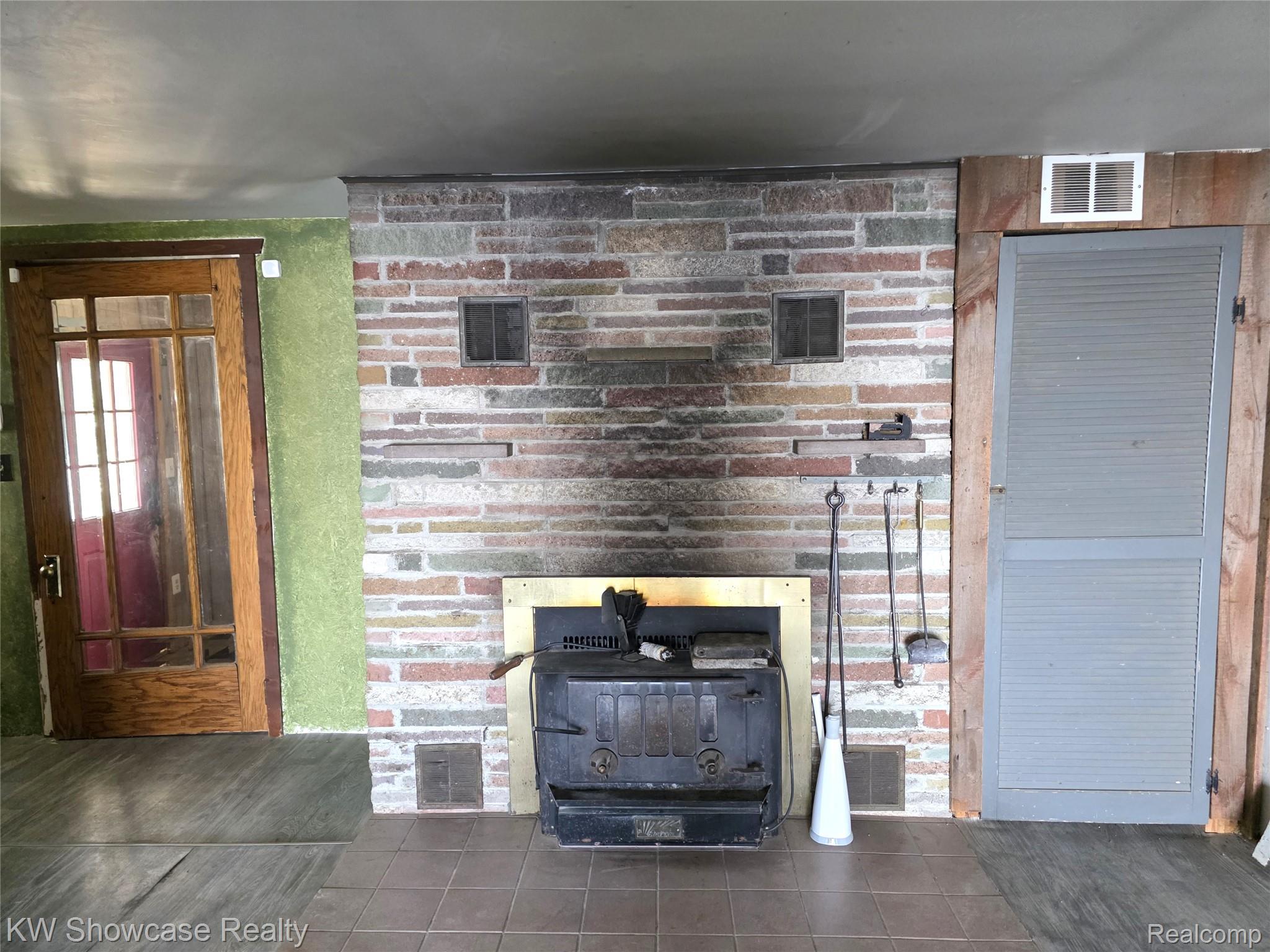 6354 Bennett Lake Road Fenton, MI 48430 - Photo 22 of 41 Detailed view of a wood stove