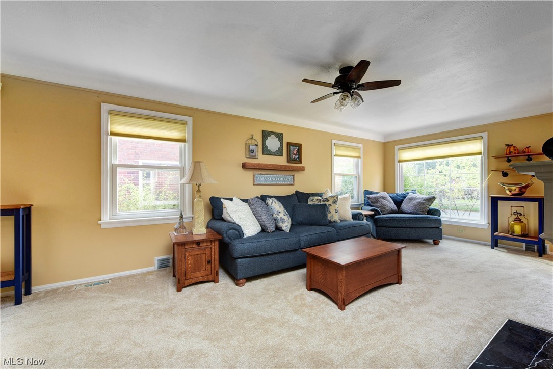19646 Henry Road Fairview Park, OH 44126 - Photo 5 of 35 Carpeted living room featuring a wealth of natural light.