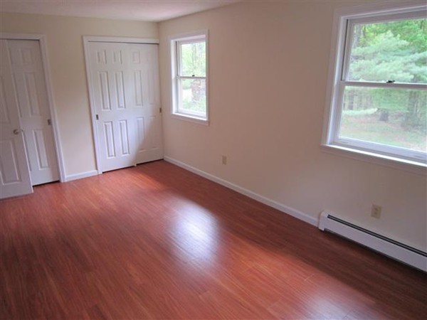 57 North Plain Road Sunderland, MA 01375 - Photo 12 of 13 a view of an empty room with wooden floor and a window
