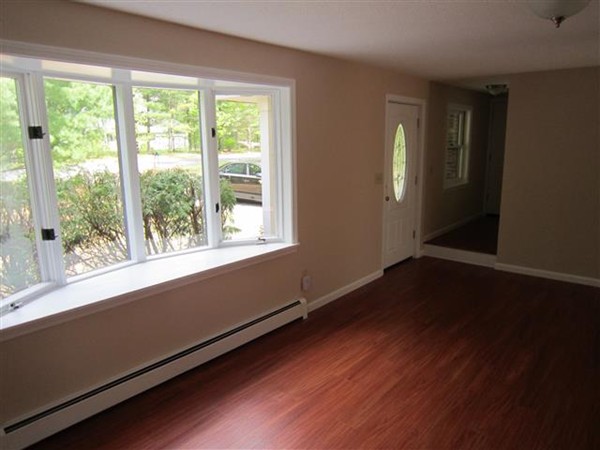 57 North Plain Road Sunderland, MA 01375 - Photo 2 of 13 an empty room with wooden floor and windows