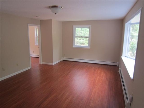 57 North Plain Road Sunderland, MA 01375 - Photo 3 of 13 an empty room with wooden floor and windows