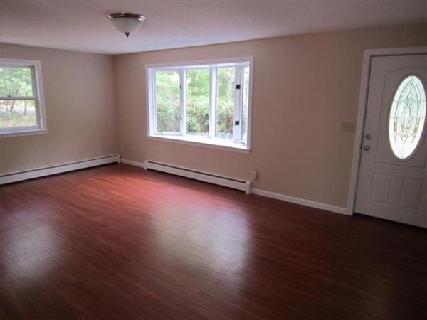 57 North Plain Road Sunderland, MA 01375 - Photo 4 of 13 an empty room with wooden floor and windows
