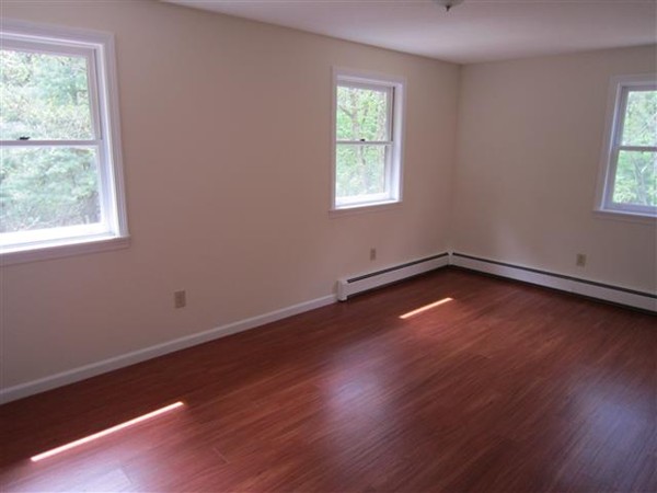 57 North Plain Road Sunderland, MA 01375 - Photo 10 of 13 an empty room with wooden floor and windows