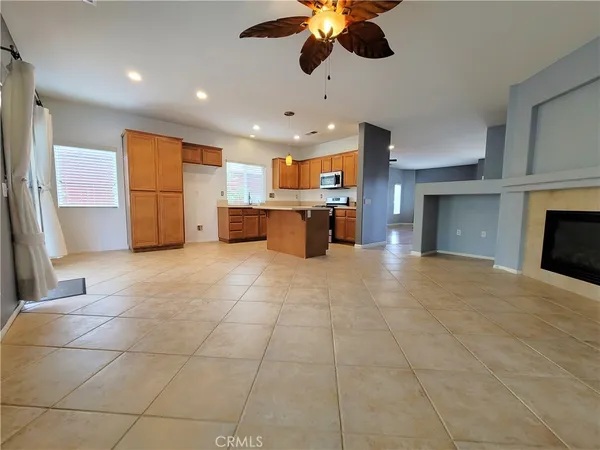 a view of a kitchen with a sink and a window