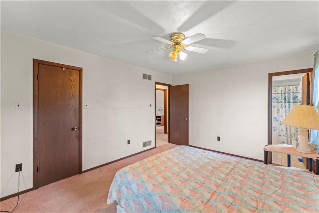 851 Mounts Road Washington, PA 15301 - Photo 15 of 28 a bedroom with a bed and a chandelier
