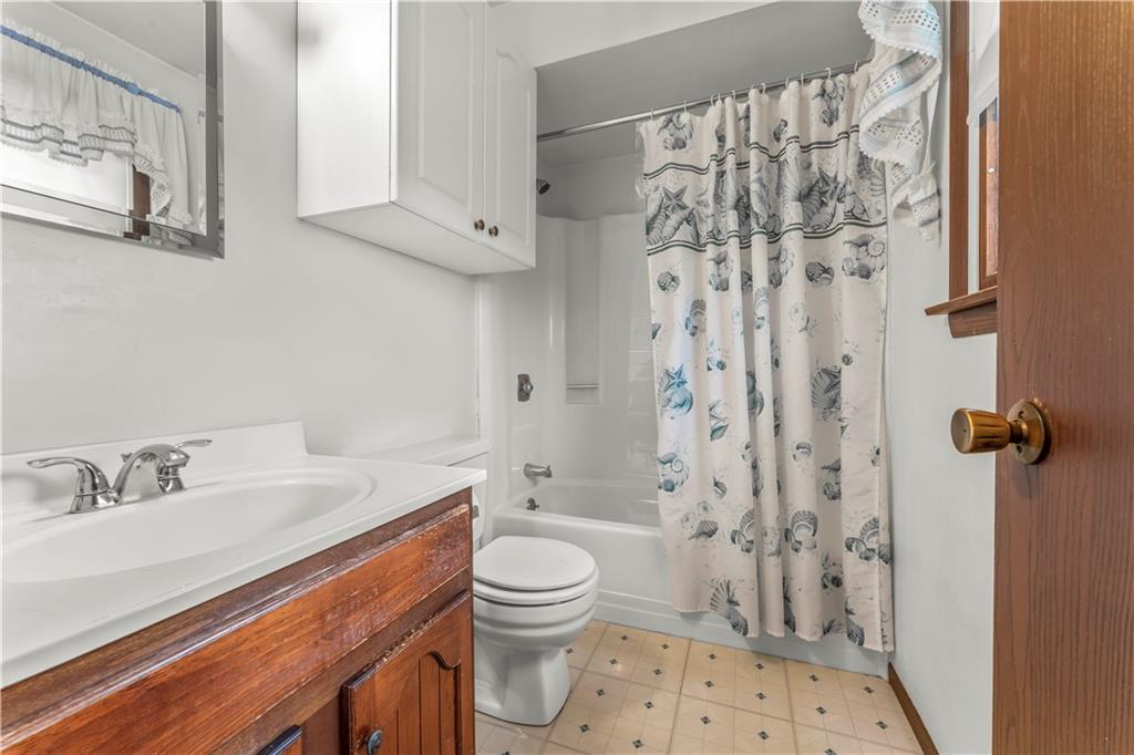 851 Mounts Road Washington, PA 15301 - Photo 16 of 28 a bathroom with a sink toilet a shower and a mirror