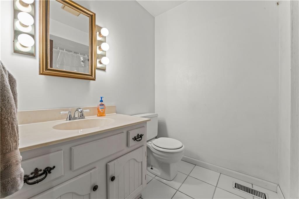 851 Mounts Road Washington, PA 15301 - Photo 20 of 28 a bathroom with a sink a toilet and a mirror