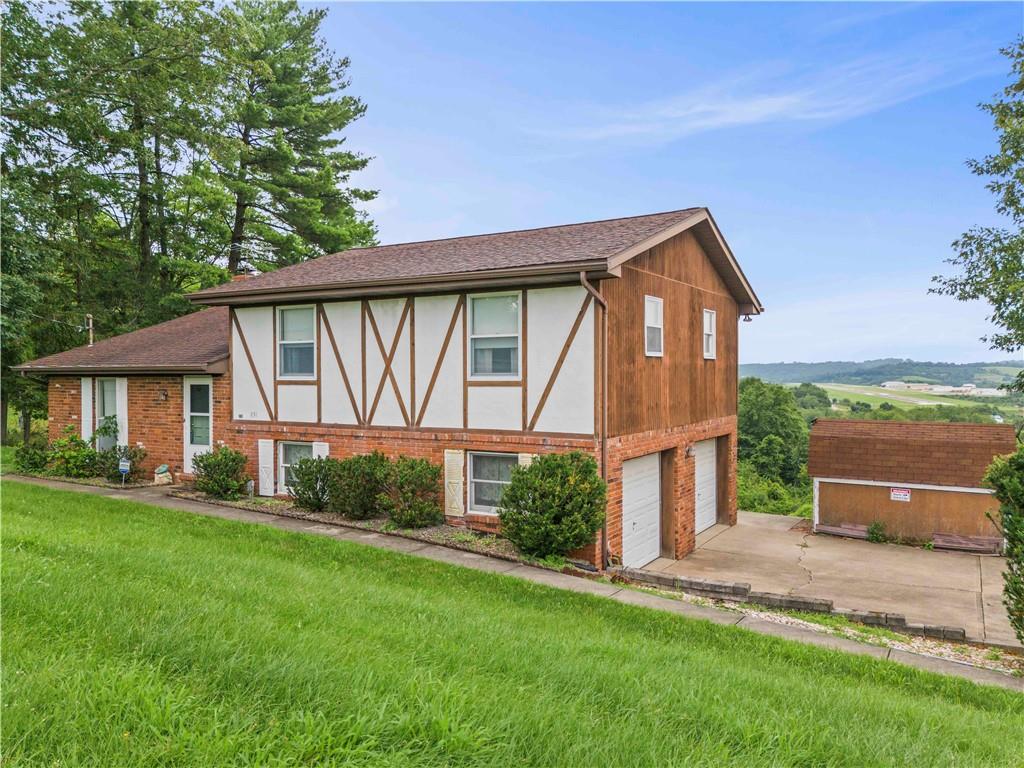 851 Mounts Road Washington, PA 15301 - Photo 2 of 28 a front view of a house with a yard
