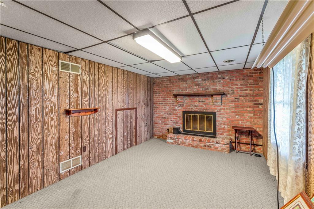 851 Mounts Road Washington, PA 15301 - Photo 23 of 28 a view of an empty room with a fireplace and a window