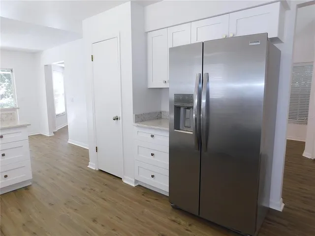 a bathroom with a double vanity sink and mirror