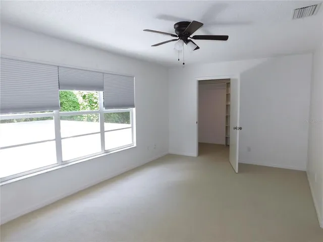 a view of an empty walk in closet
