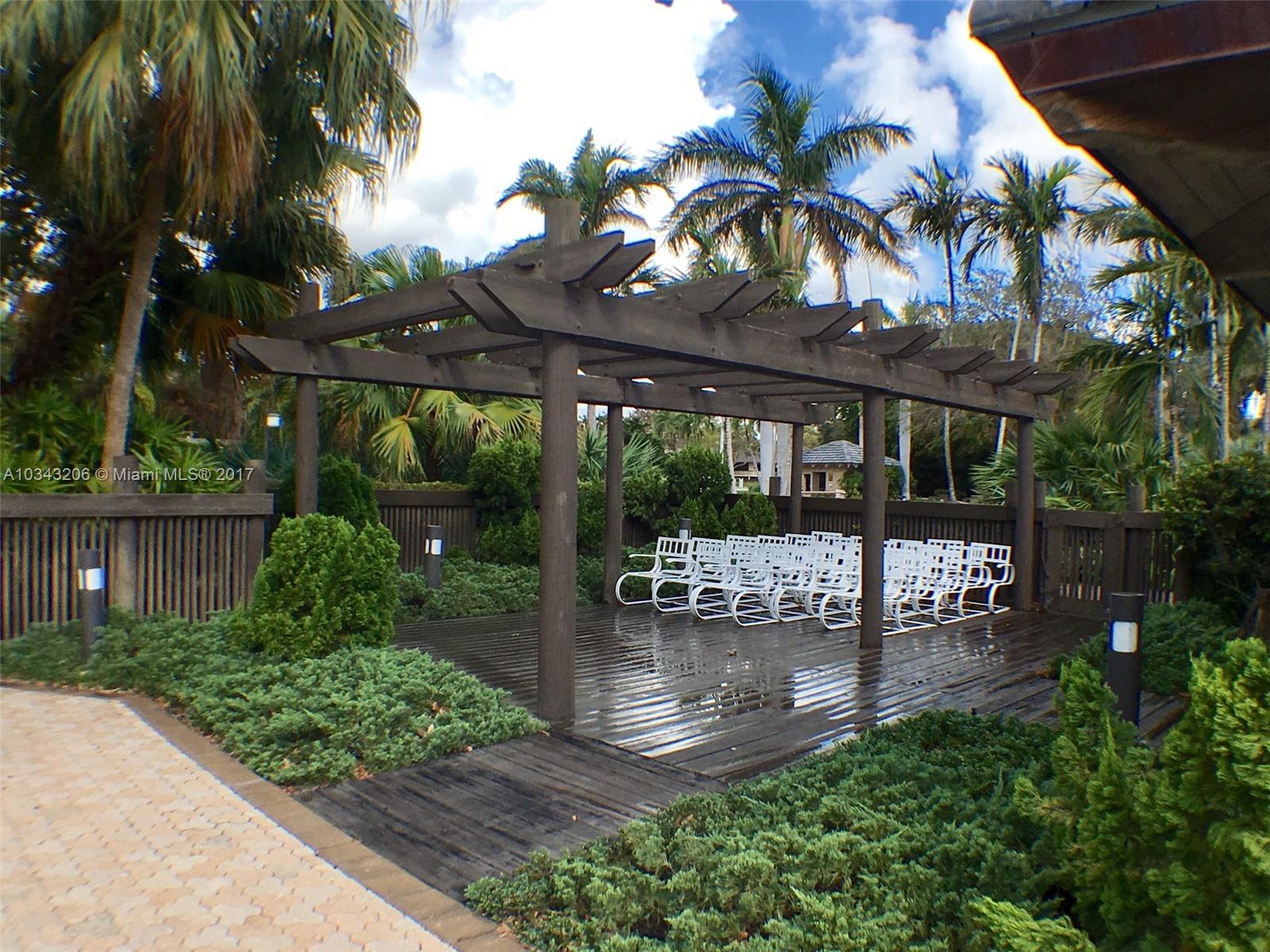 608 Boca Marina Court, Unit 608 Boca Raton, FL 33487 - Photo 16 of 20 COMMON AREA BY POOL