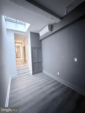 a view of wooden floor with brick walls