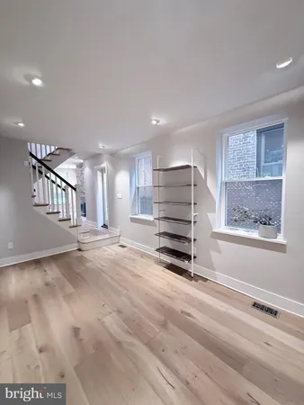 a kitchen with kitchen island granite countertop a sink appliances cabinets and counter space