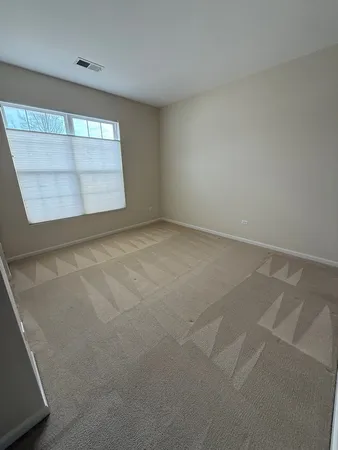 a bathroom with a double vanity sink toilet and shower
