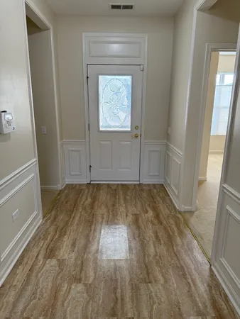 a view of room with window and hardwood floor