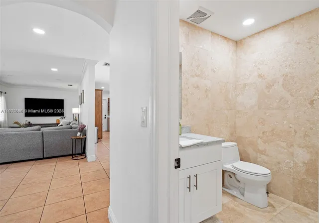 a living room with a couch and a flat screen tv