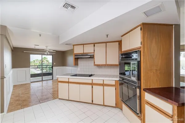 a kitchen with a sink cabinets and window