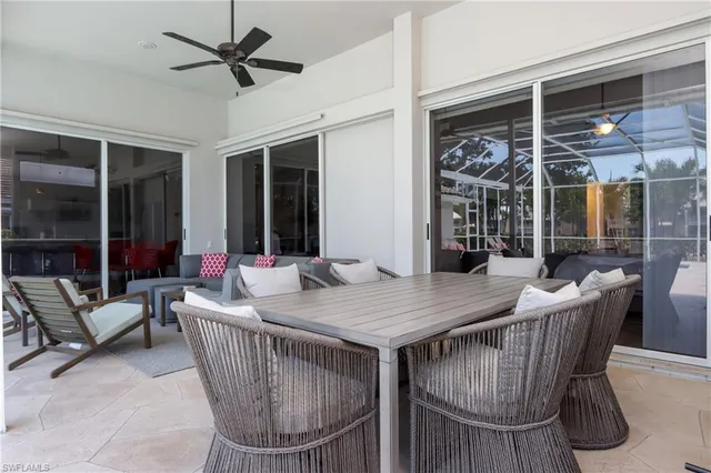 a view of a dining table and chairs in the patio