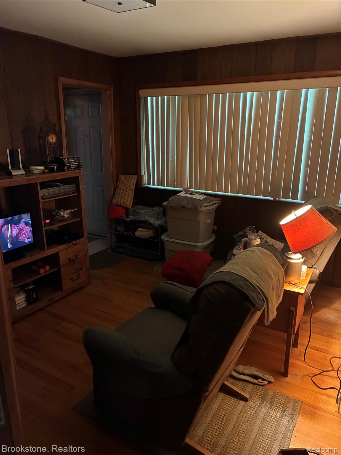 137 Michelson Road Rochester, MI 48307 - Photo 15 of 15 Wood-finish flooring complemented by paneled walls and a ceiling-mounted light fixture
