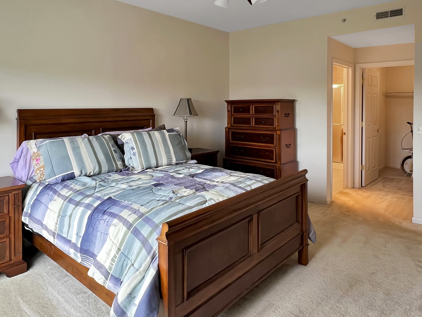 3451 North Carriageway Drive, Unit 503 Arlington Heights, IL 60004 - Photo 13 of 22 a bed sitting in a bedroom next to a cabinet