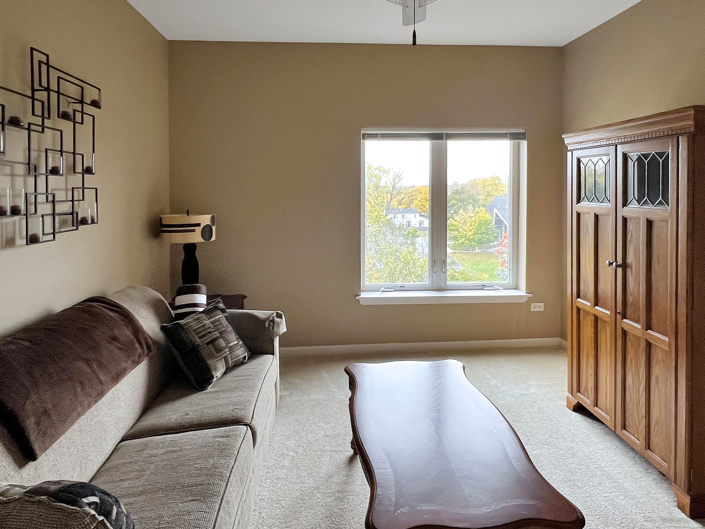 3451 North Carriageway Drive, Unit 503 Arlington Heights, IL 60004 - Photo 15 of 22 a living room with furniture and a window