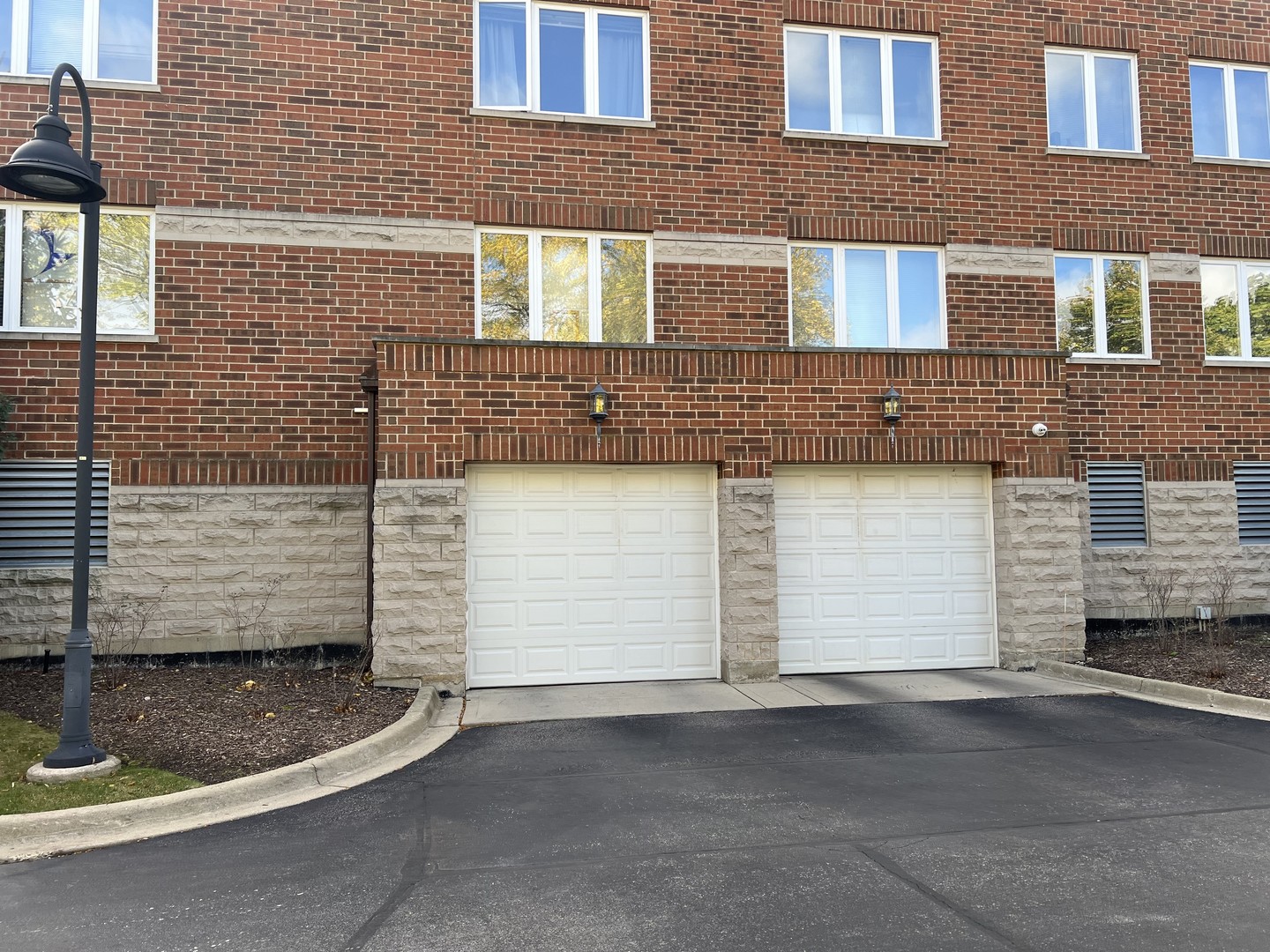 3451 North Carriageway Drive, Unit 503 Arlington Heights, IL 60004 - Photo 21 of 22 a view of a brick house with many windows