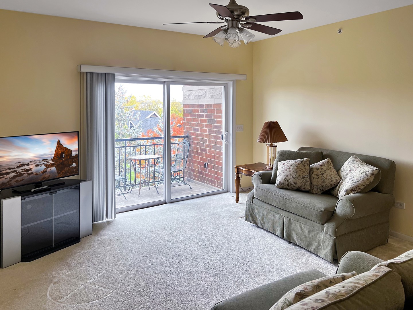 3451 North Carriageway Drive, Unit 503 Arlington Heights, IL 60004 - Photo 9 of 22 a living room with furniture and a flat screen tv