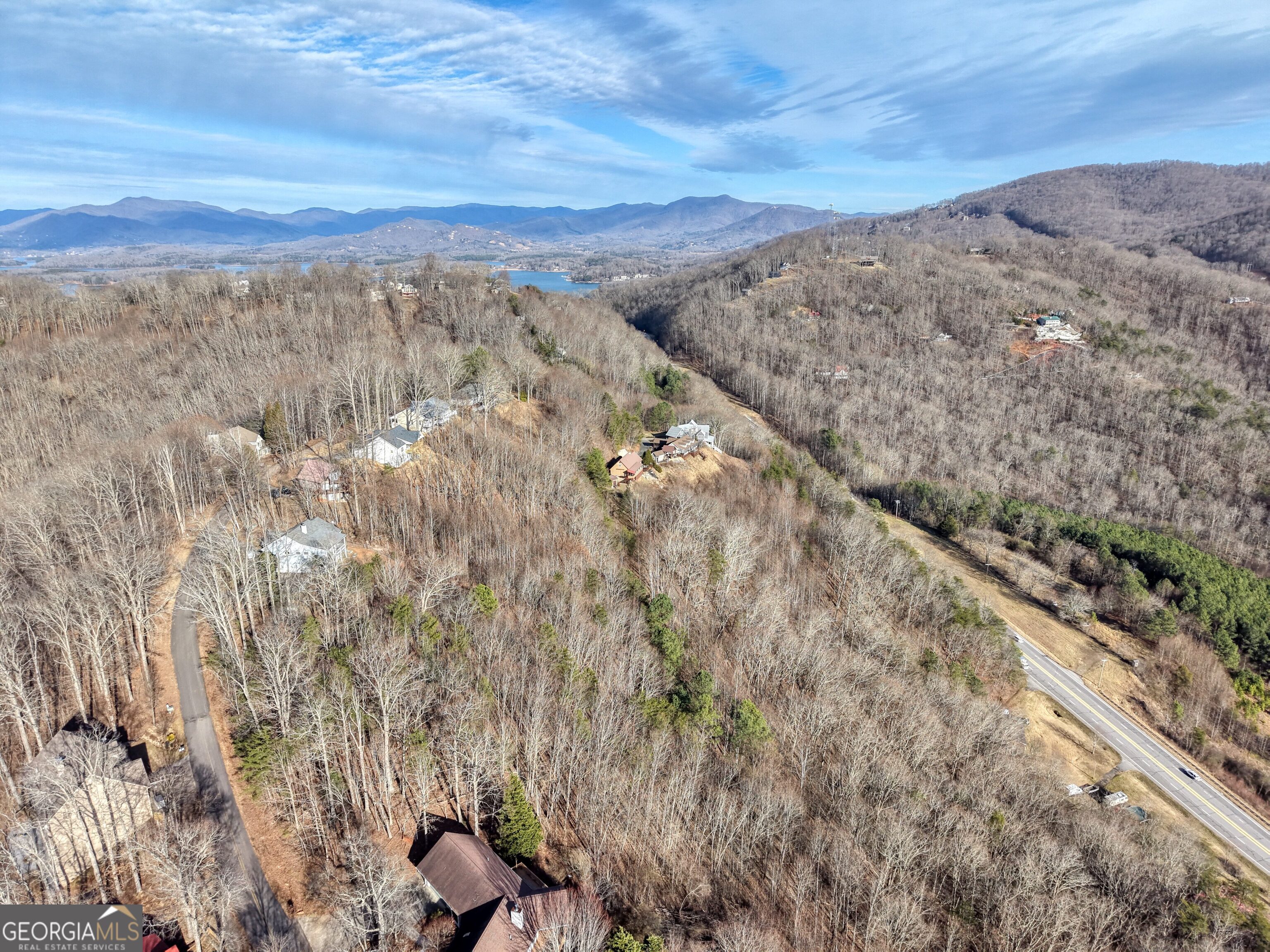 Lot 5 Harris Ridge Young Harris, GA 30582 - Photo 13 of 15 a view of a dry yard with mountains in the background