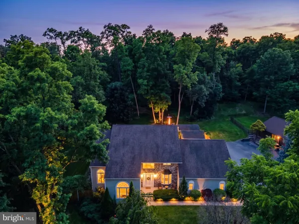 an aerial view of a house with outdoor space
