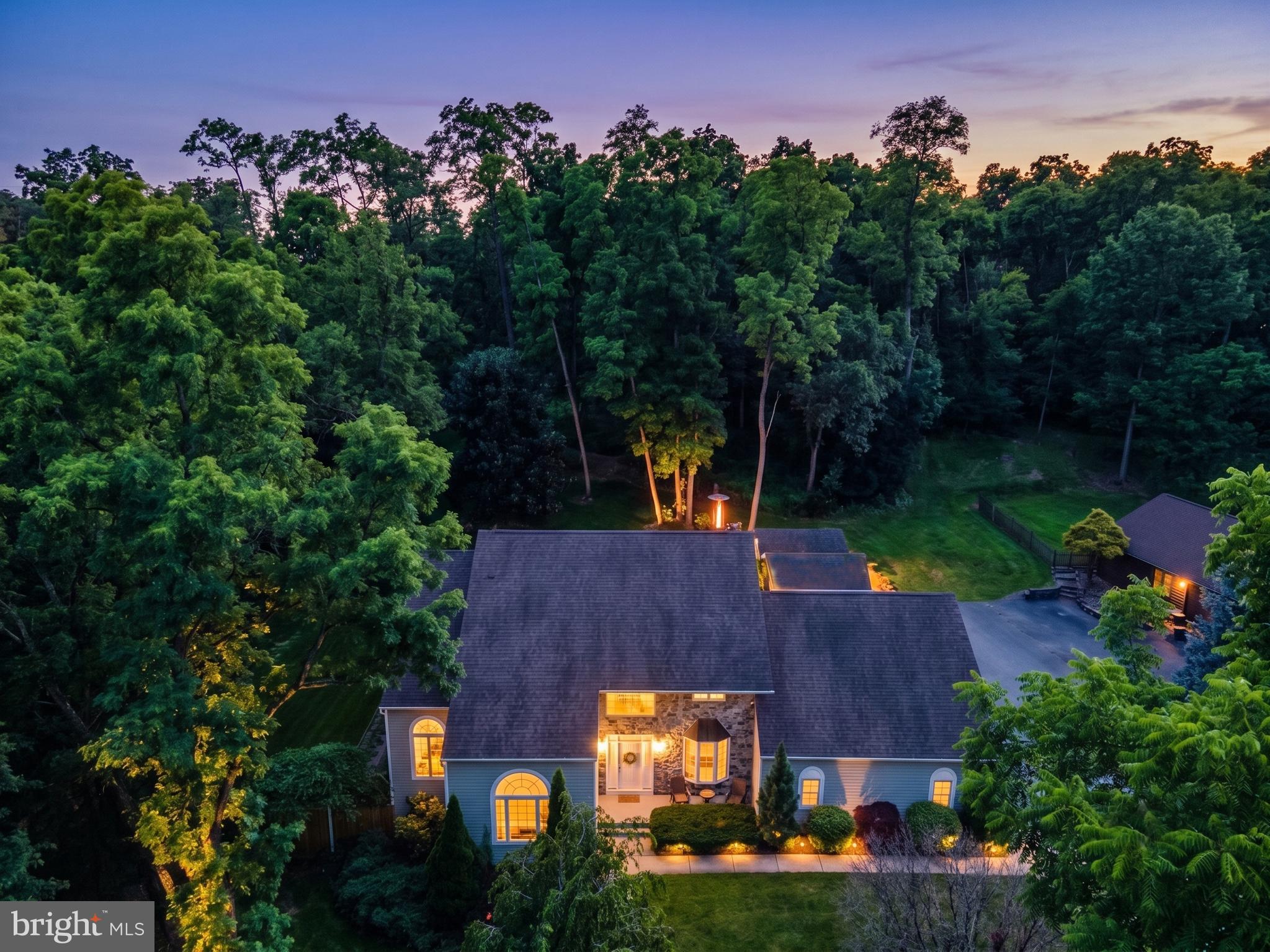 an aerial view of a house with outdoor space