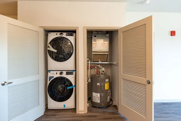 a view of a hallway with washer and dryer