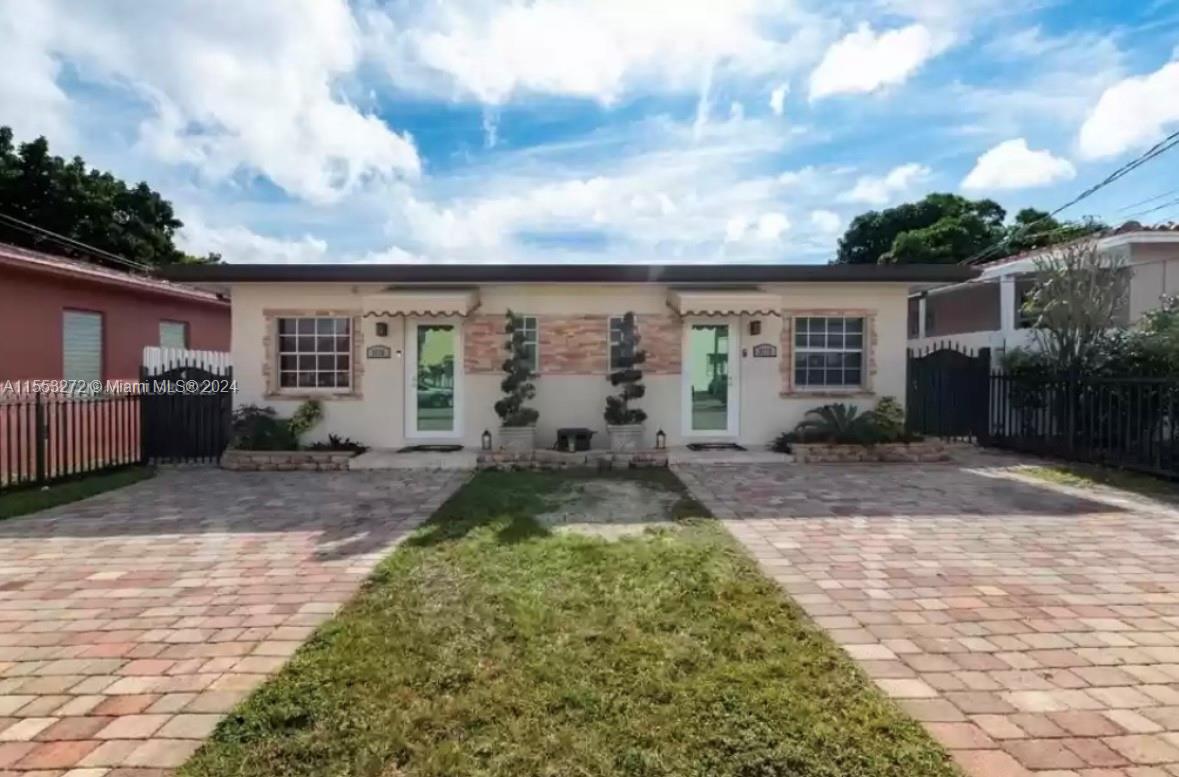 3172 Southwest 2nd Street, Unit 3172 Miami, FL 33135 - Photo 1 of 15 front view of a house with a yard