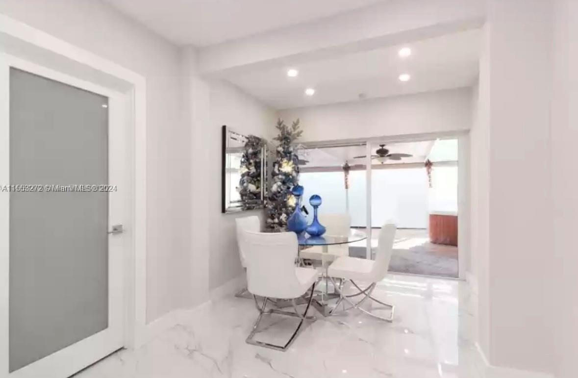 3172 Southwest 2nd Street, Unit 3172 Miami, FL 33135 - Photo 10 of 15 a view of a dining room with furniture and a window