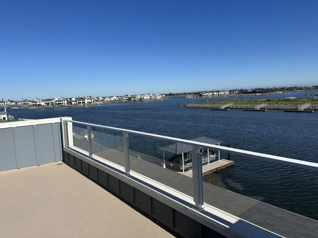 a view of balcony with furniture