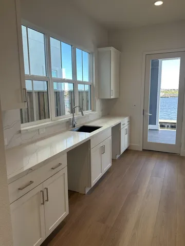 a kitchen with a sink and cabinets