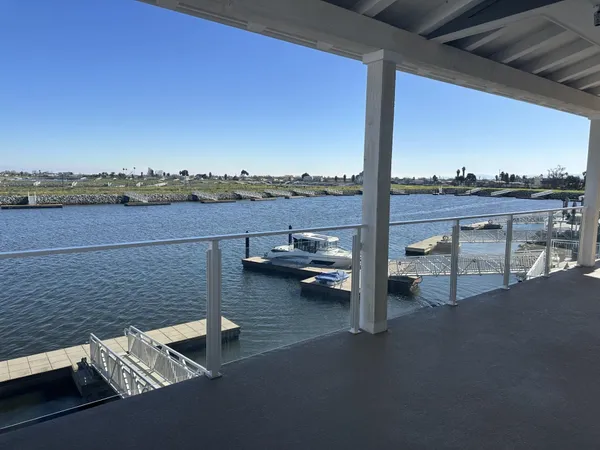 a view of roof deck with patio