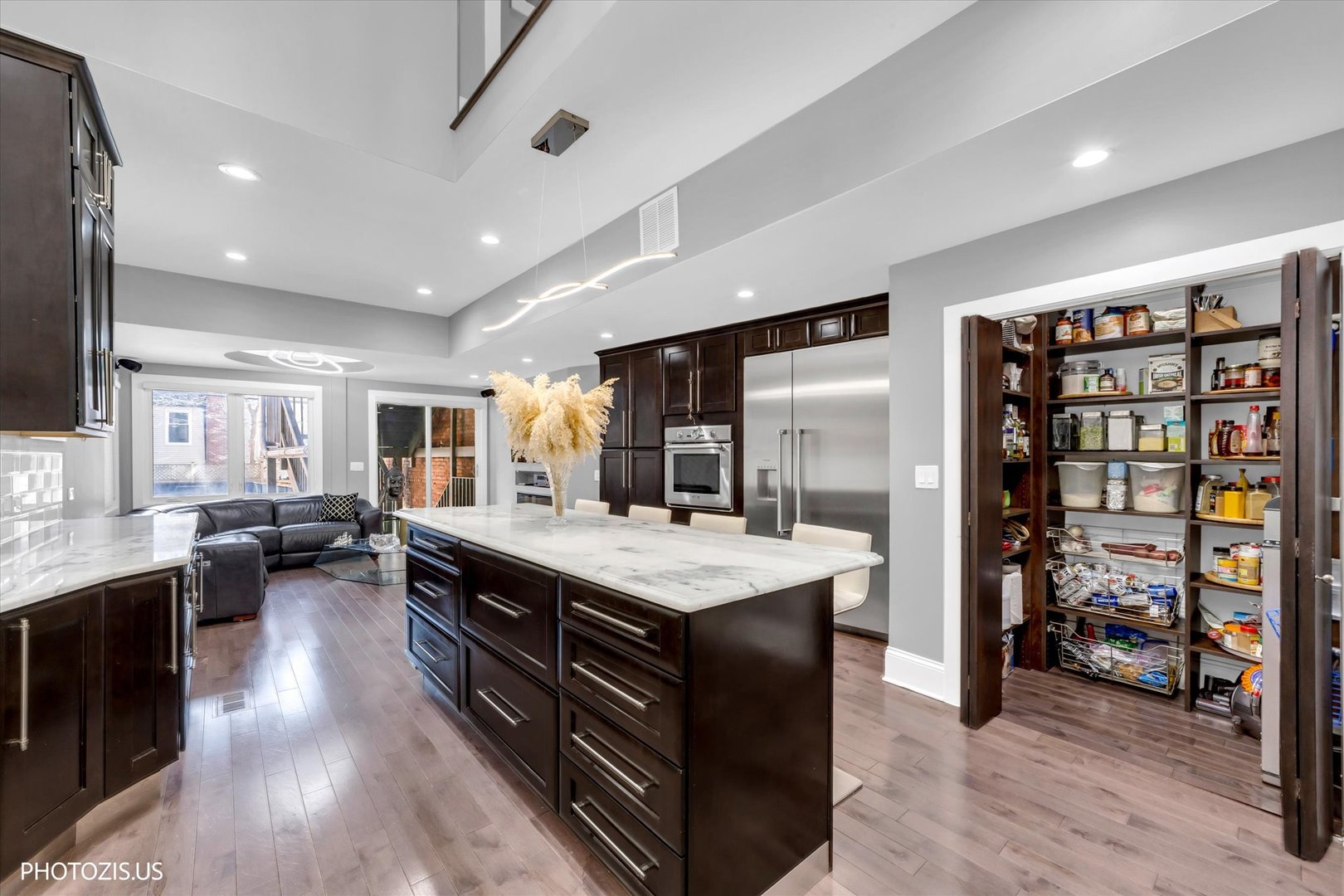 461 West Melrose Street Chicago, IL 60657 - Photo 15 of 83 a large kitchen with stainless steel appliances lots of counter space